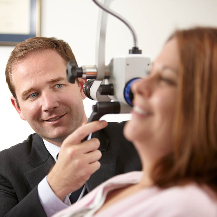 ENT Specialist examining a patient's ear